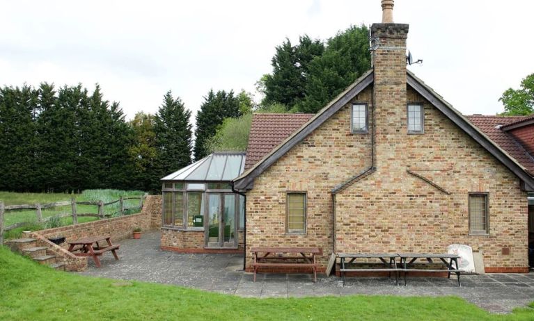 Exterior view and lounge seating at Little Foxes Hotel.