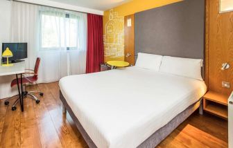 Bright and spacious day use room with king bed and work desk at Ibis Styles Crewe.