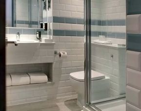 Private guest bathroom with shower at Aparthotel Best Western Plus London Croydon.