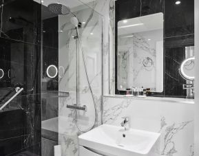 Private guest bathroom with shower at Best Western Plus Dover Marina Hotel & Spa.