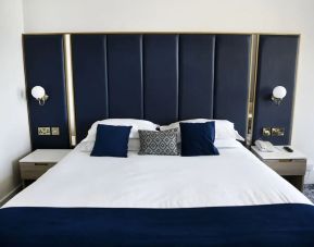 King bed at Best Western Plus Dover Marina Hotel & Spa.