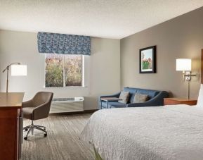 Day use room with work desk and sofa at Hampton Inn Phoenix-Midtown-Downtown Area.