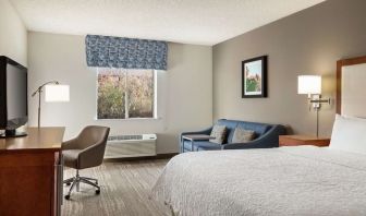 Day use room with work desk and sofa at Hampton Inn Phoenix-Midtown-Downtown Area.