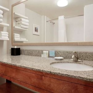 Guest bathroom with shower at Hampton Inn Phoenix-Midtown-Downtown Area.