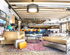 Lobby and coworking lounge at Moxy Phoenix Tempe/ASU Area.