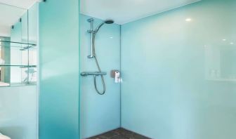 Guest bathroom with shower at Ibis Styles Haydock.