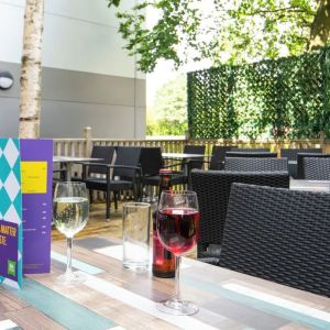 Terrace patio with lounge seating at Ibis Styles Haydock.