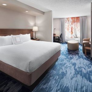 Day use room with work desk and sofa at Fairfield Inn By Marriott Denver Airport.