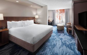 Day use room with work desk and sofa at Fairfield Inn By Marriott Denver Airport.