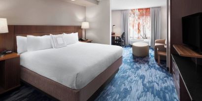 Day use room with work desk and sofa at Fairfield Inn By Marriott Denver Airport.