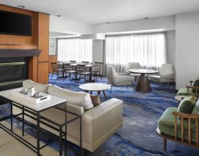 Lobby and coworking lounge at Fairfield Inn By Marriott Denver Airport.