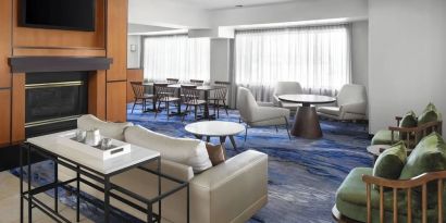 Lobby and coworking lounge at Fairfield Inn By Marriott Denver Airport.