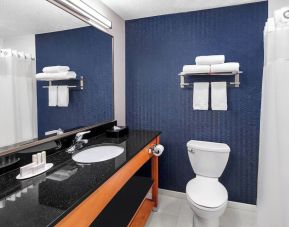 Guest bathroom with shower at Fairfield Inn By Marriott Denver Airport.