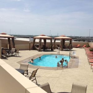 Refreshing outdoor pool in rooftop of Hyatt Regency Dallas.