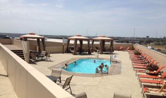 Refreshing outdoor pool in rooftop of Hyatt Regency Dallas.