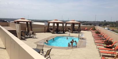 Refreshing outdoor pool in rooftop of Hyatt Regency Dallas.