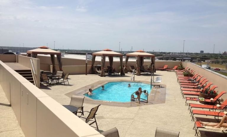 Refreshing outdoor pool in rooftop of Hyatt Regency Dallas.