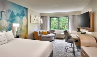 Day use room with sofa and work desk at Courtyard By Marriott Charlotte Airport/Billy Graham Parkway.