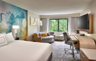 Day use room with sofa and work desk at Courtyard By Marriott Charlotte Airport/Billy Graham Parkway.