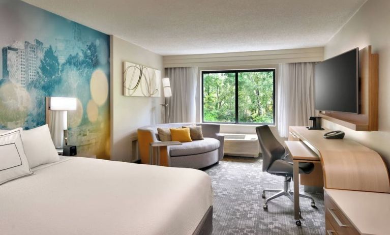 Day use room with sofa and work desk at Courtyard By Marriott Charlotte Airport/Billy Graham Parkway.