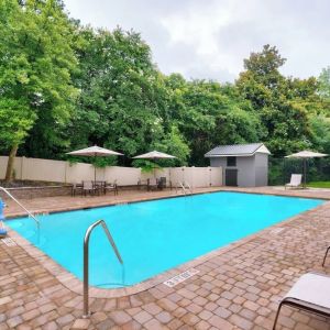 Refreshing outdoor pool at Courtyard By Marriott Charlotte Airport/Billy Graham Parkway.