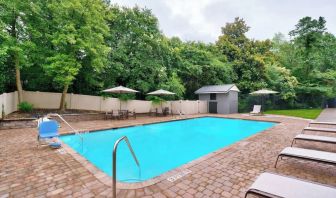 Refreshing outdoor pool at Courtyard By Marriott Charlotte Airport/Billy Graham Parkway.