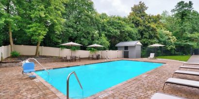 Refreshing outdoor pool at Courtyard By Marriott Charlotte Airport/Billy Graham Parkway.