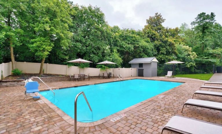 Refreshing outdoor pool at Courtyard By Marriott Charlotte Airport/Billy Graham Parkway.