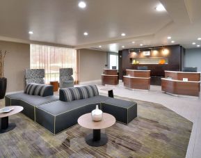 Lobby and coworking lounge at Courtyard By Marriott Charlotte Airport/Billy Graham Parkway.