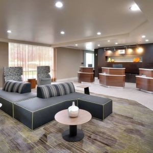 Lobby and coworking lounge at Courtyard By Marriott Charlotte Airport/Billy Graham Parkway.