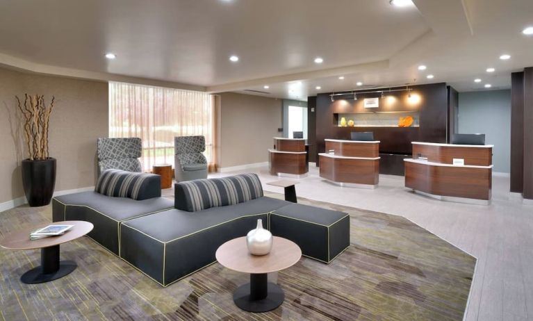 Lobby and coworking lounge at Courtyard By Marriott Charlotte Airport/Billy Graham Parkway.