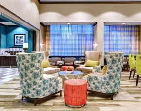 Lobby and coworking lounge at Hampton Inn & Suites Atlanta Perimeter Dunwoody.