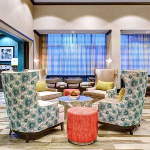 Lobby and coworking lounge at Hampton Inn & Suites Atlanta Perimeter Dunwoody.