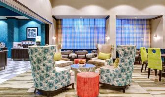 Lobby and coworking lounge at Hampton Inn & Suites Atlanta Perimeter Dunwoody.