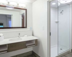 Guest bathroom with shower at Hampton Inn & Suites Atlanta Perimeter Dunwoody.