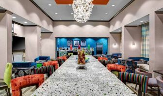 Dining area perfect for coworking at Hampton Inn & Suites Atlanta Perimeter Dunwoody.