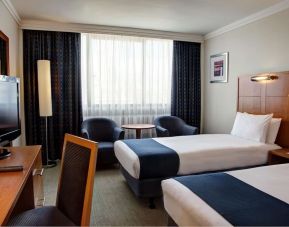 Day use twin room with work desk and lounge seating at Best Western London Heathrow Ariel Hotel.