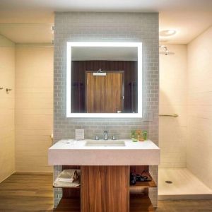 Guest bathroom with shower and free toiletries at Wyndham Garden North Bergen Near Secaucus.