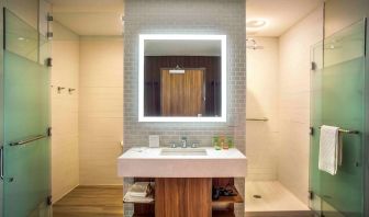 Guest bathroom with shower and free toiletries at Wyndham Garden North Bergen Near Secaucus.