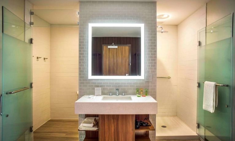 Guest bathroom with shower and free toiletries at Wyndham Garden North Bergen Near Secaucus.