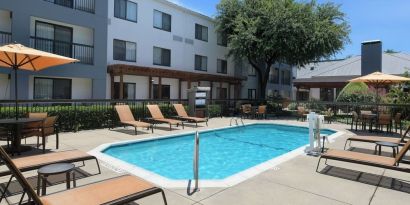 Refreshing outdoor pool at Courtyard By Marriott Dallas DFW Airport North/Irving.