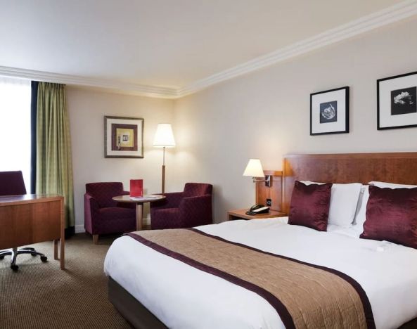 Standard day use room with work desk, lounge seating and private bathroom at Crowne Plaza London - Heathrow.