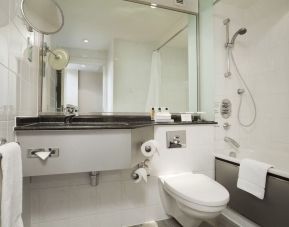 Private guest bathroom with shower at Crowne Plaza London - Heathrow.
