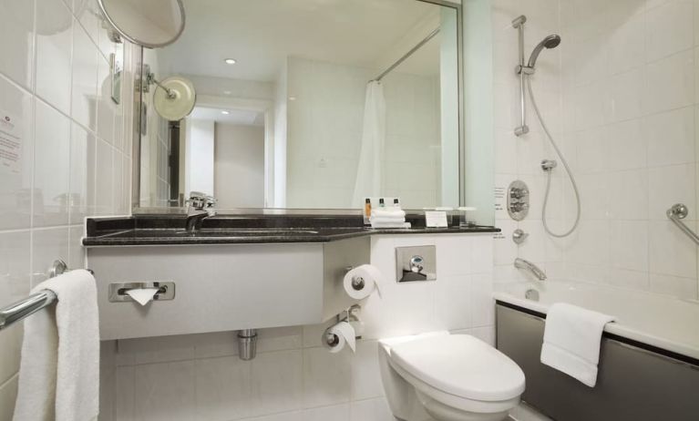 Private guest bathroom with shower at Crowne Plaza London - Heathrow.
