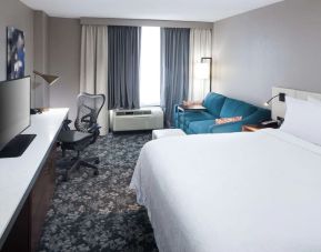 Day use room with work desk and sofa at Hilton Garden Inn Nashville Vanderbilt.