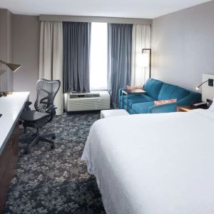 Day use room with work desk and sofa at Hilton Garden Inn Nashville Vanderbilt.