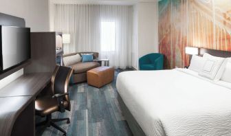 Day use room with work desk and sofa at Courtyard By Marriott Fort Worth Historic Stockyards.