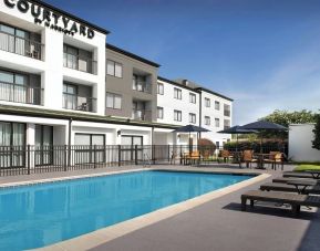 Refreshing outdoor pool at Courtyard By Marriott Hattiesburg.