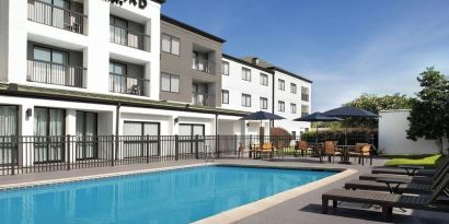 Refreshing outdoor pool at Courtyard By Marriott Hattiesburg.