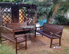 Outdoor sitting area at Campbell Guest House Hotel.